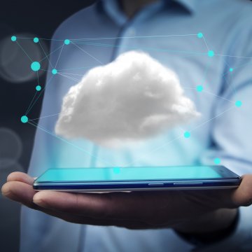 cloud communications man holding smartphone cloud above phone display nextiva services vfax online fax service voip services